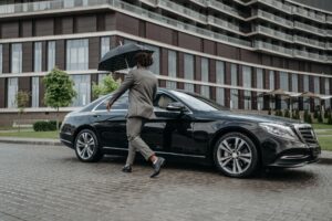 businessman walking out of office building
