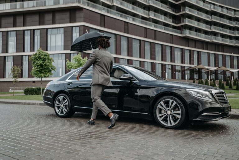 businessman walking out of office building